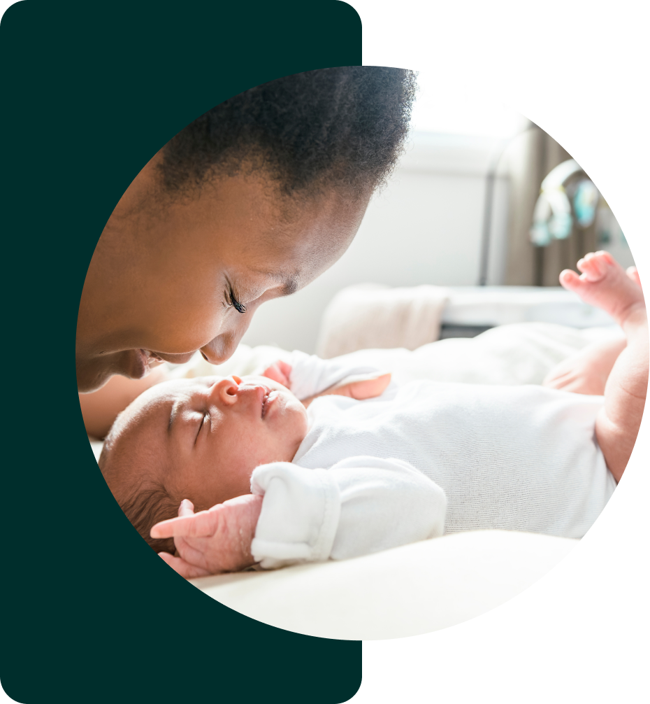 A parent holding their newborn