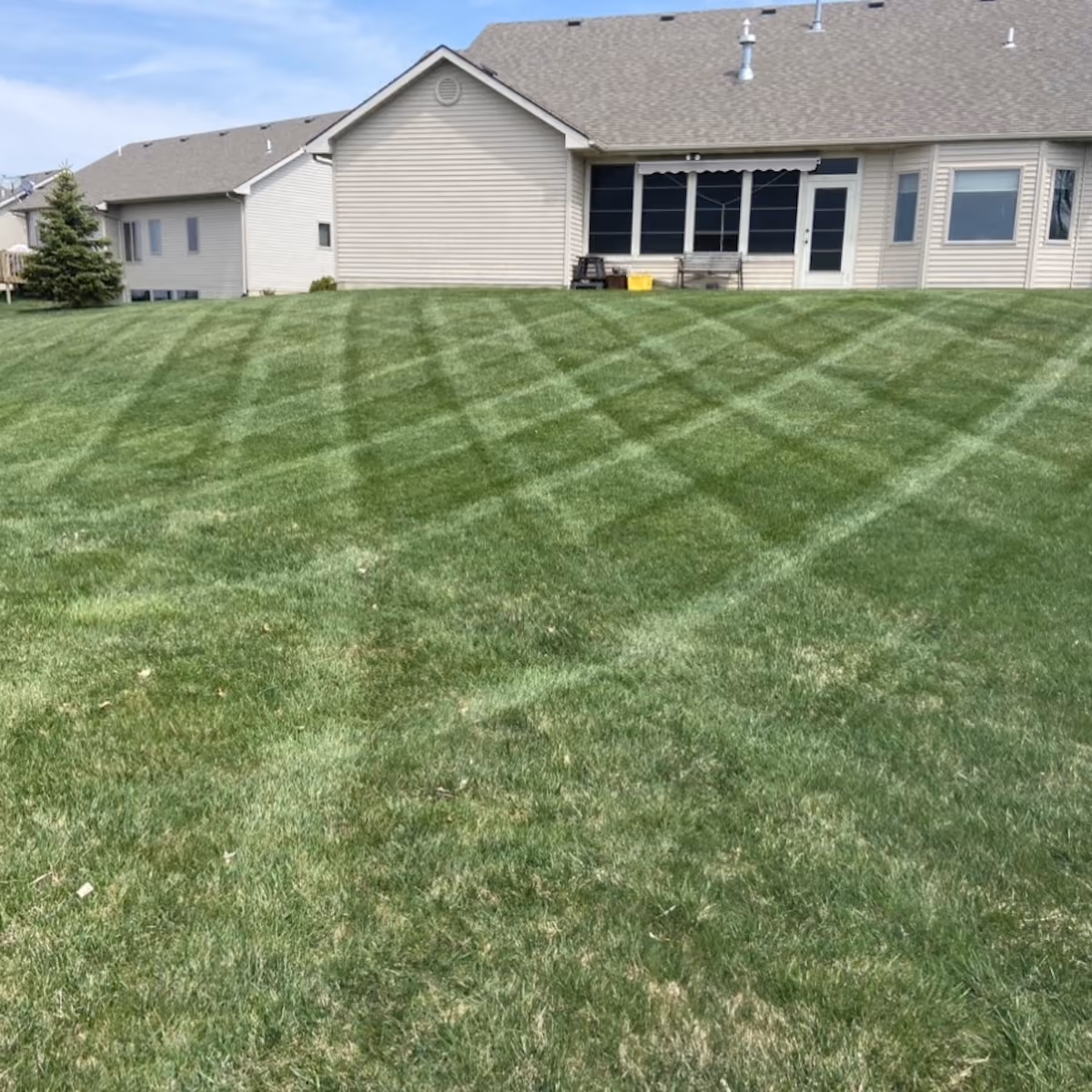 striped residential lawn after professional mowing | Monmouth Valley Lawn and Landscaping