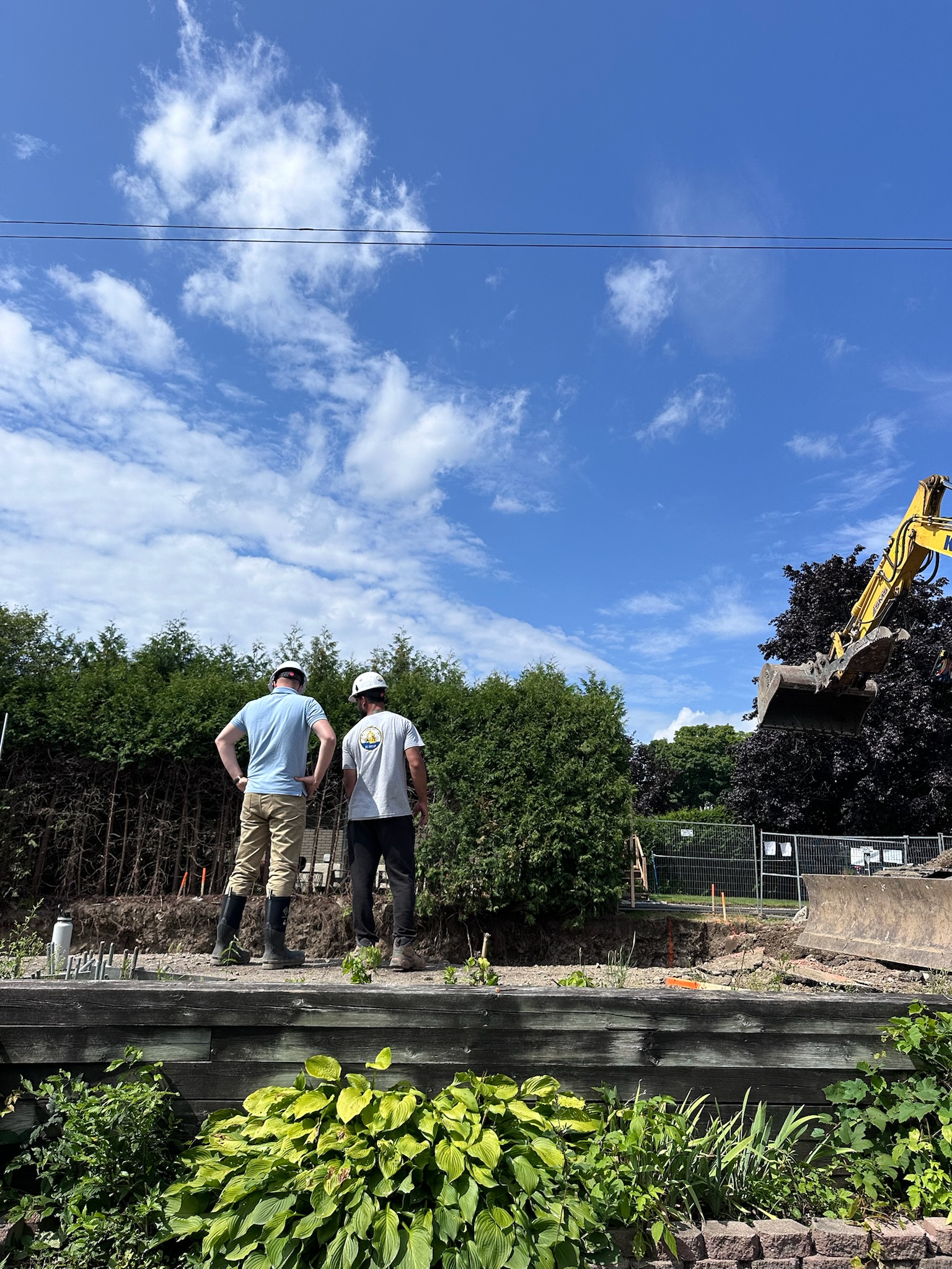 Veinard Developments team reviewing an active excavation site in Ottawa