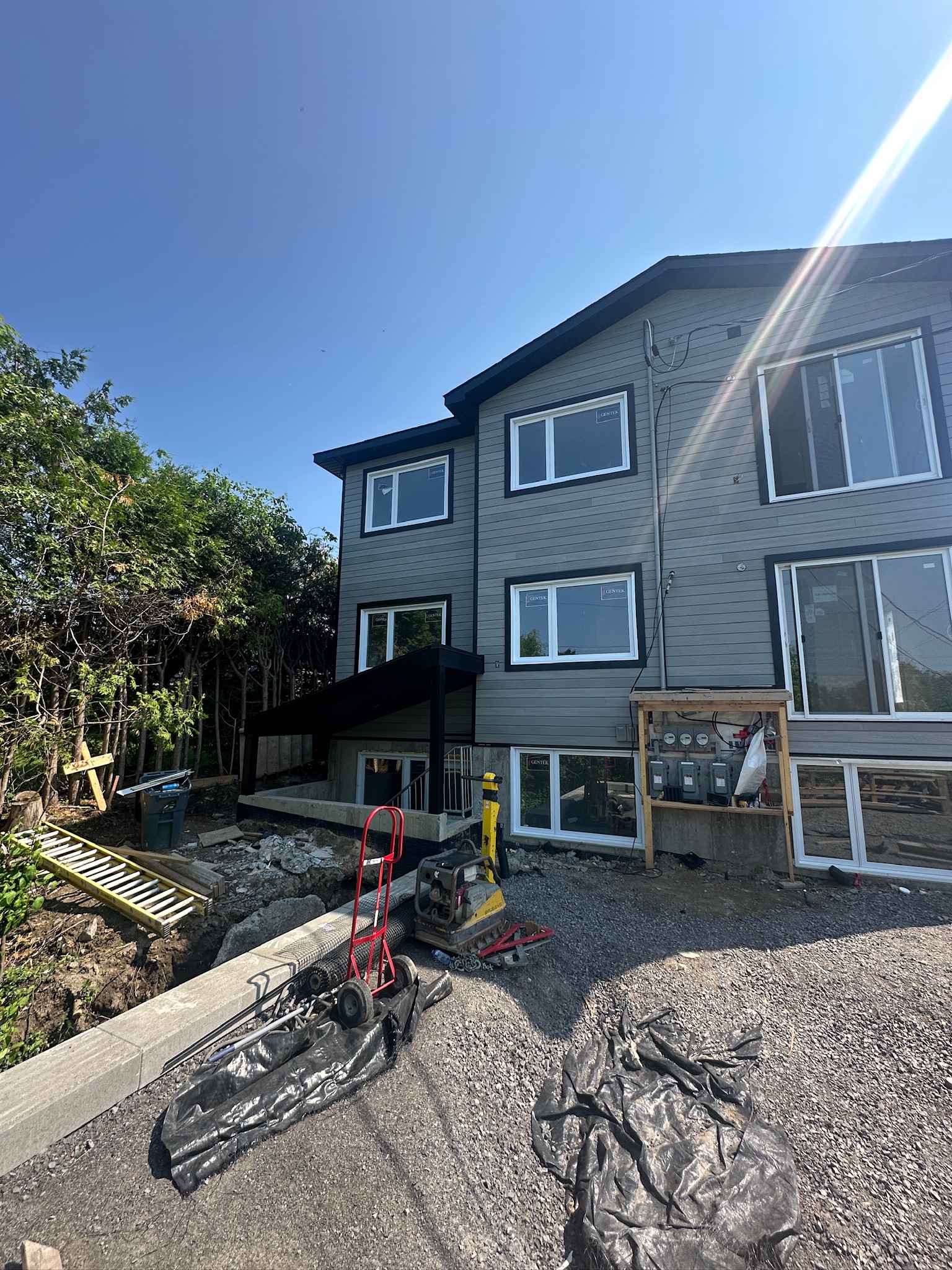 692 Crystal St rear exterior progress