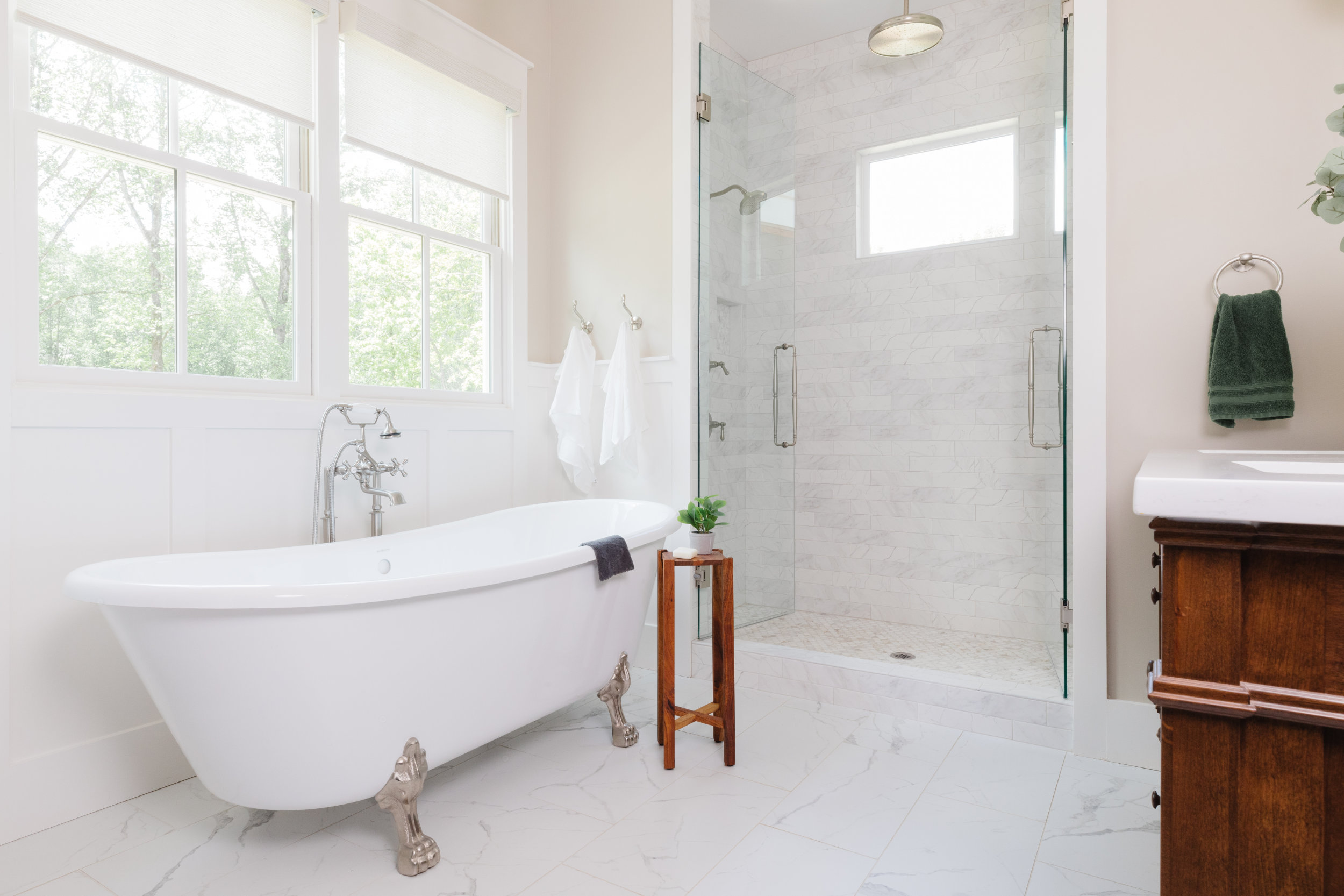 Custom farmhouse with standalone tub in master bathroom