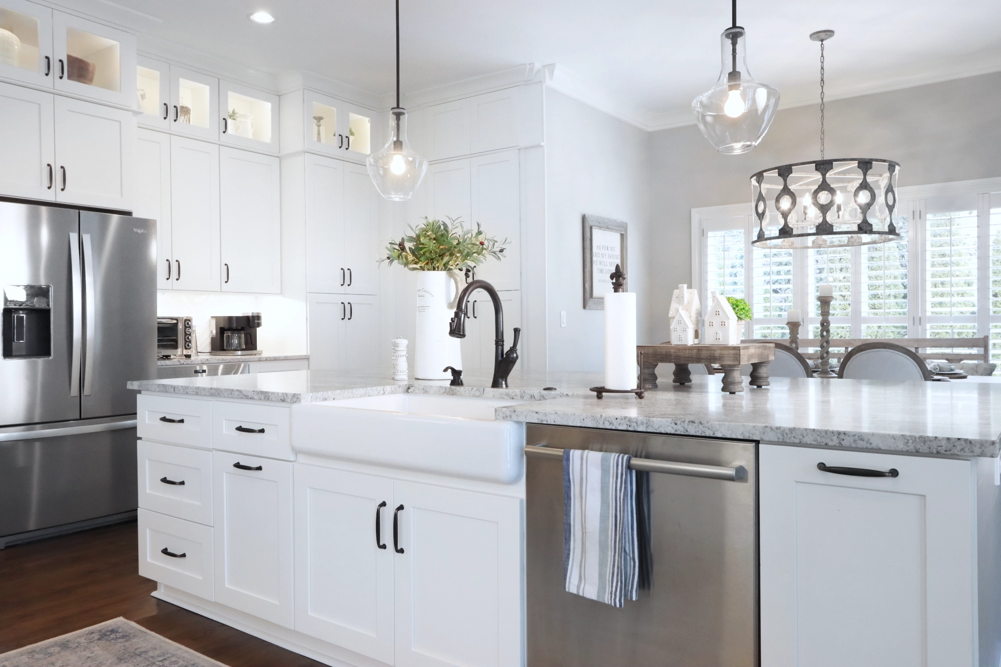 Kitchen remodel with white cabinetry and matte black fixtures