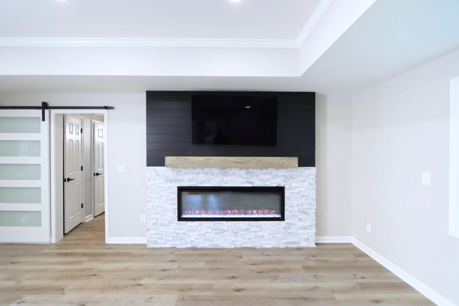 In wall fireplace under wall mounted Television