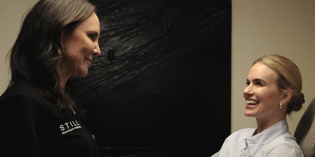 Host and guest laughing together during a STILL Social evening