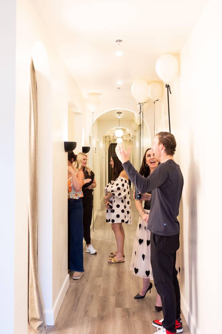 Friends mingling in the studio during a STILL Social private event