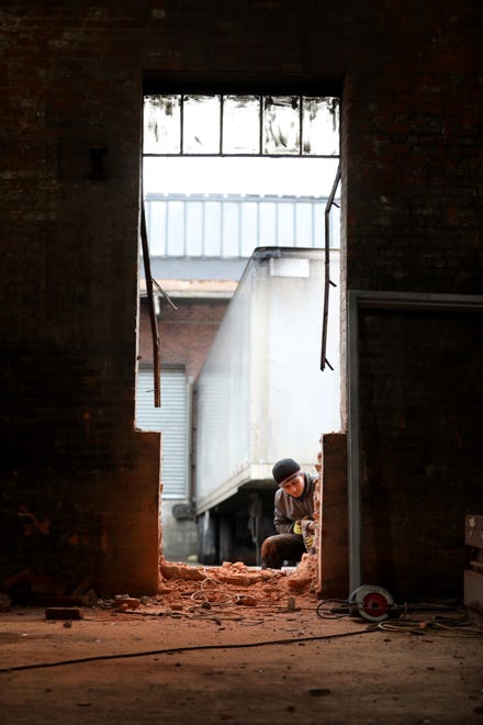A man works on a building at Botany Mills, located at 90 Dayton Ave. in Passaic. Tuesday December 10, 2019