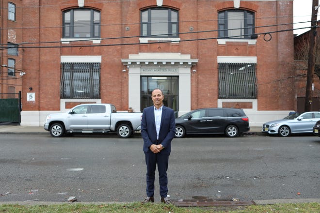 President of Mynt Properties, Joseph Smouha, poses for a photograph outside the company's Passaic office.  Mynt Properties is believed to be own more property in Passaic than any other individual or company. Tuesday December 10, 2019