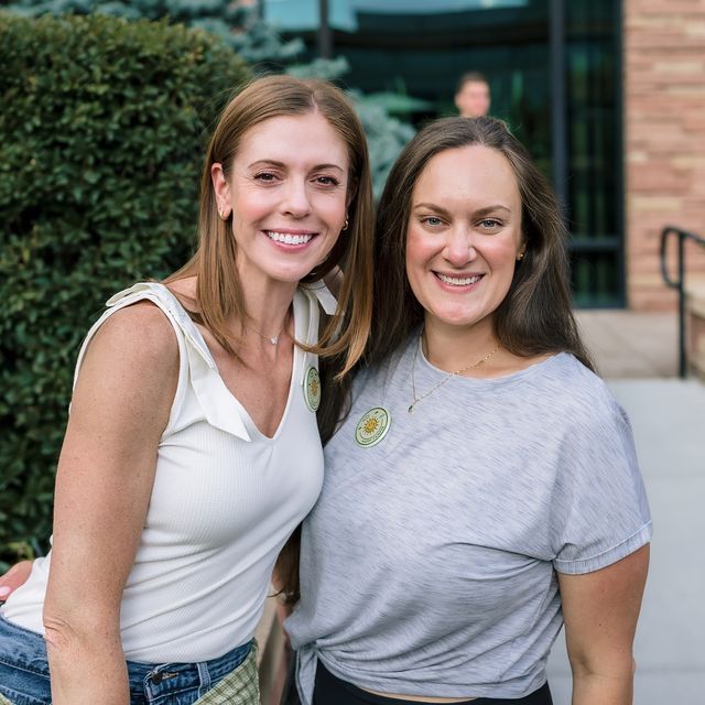 Two teammates outside the Boulder office