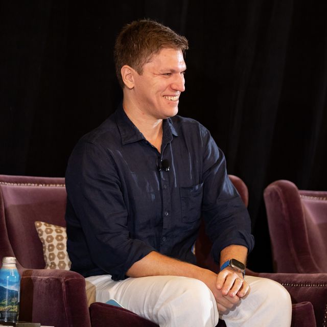 A teammate mid-conversation during a fireside session