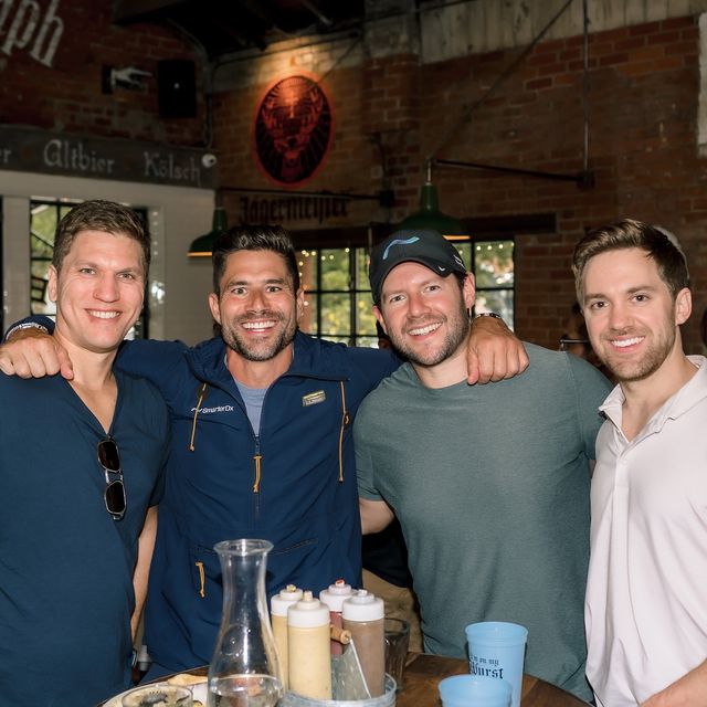 Four teammates at a brewery during a team offsite