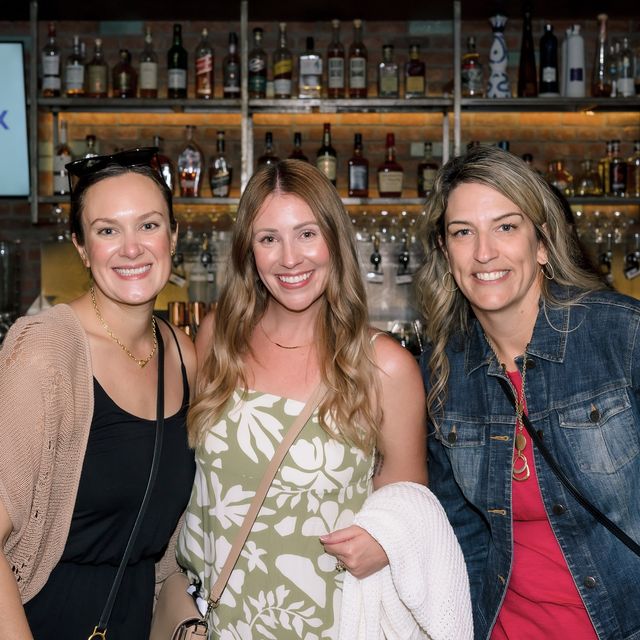 Three teammates together at a bar