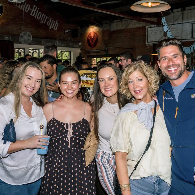Five teammates together at a bar
