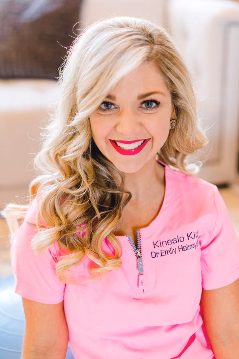 Dr. Emily Heisey in a pink KinesioKids clinic shirt, 2019