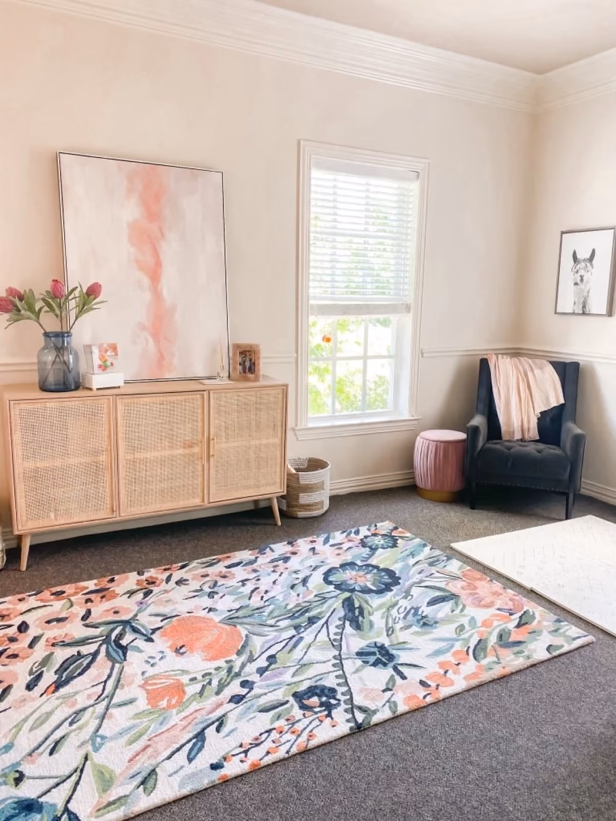 KinActive Kids' first private treatment room, with a floral rug, rattan cabinet and armchair
