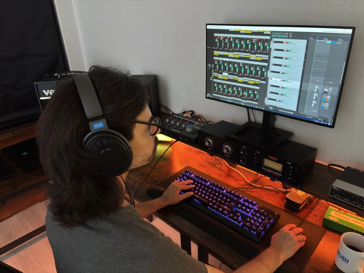 Dogu at the mixing console during an audio session