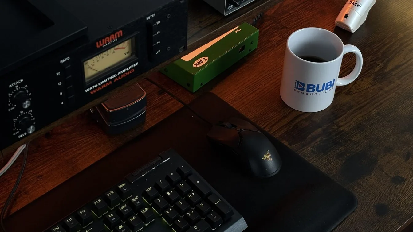 A BUBI mug on a studio desk beside the gear
