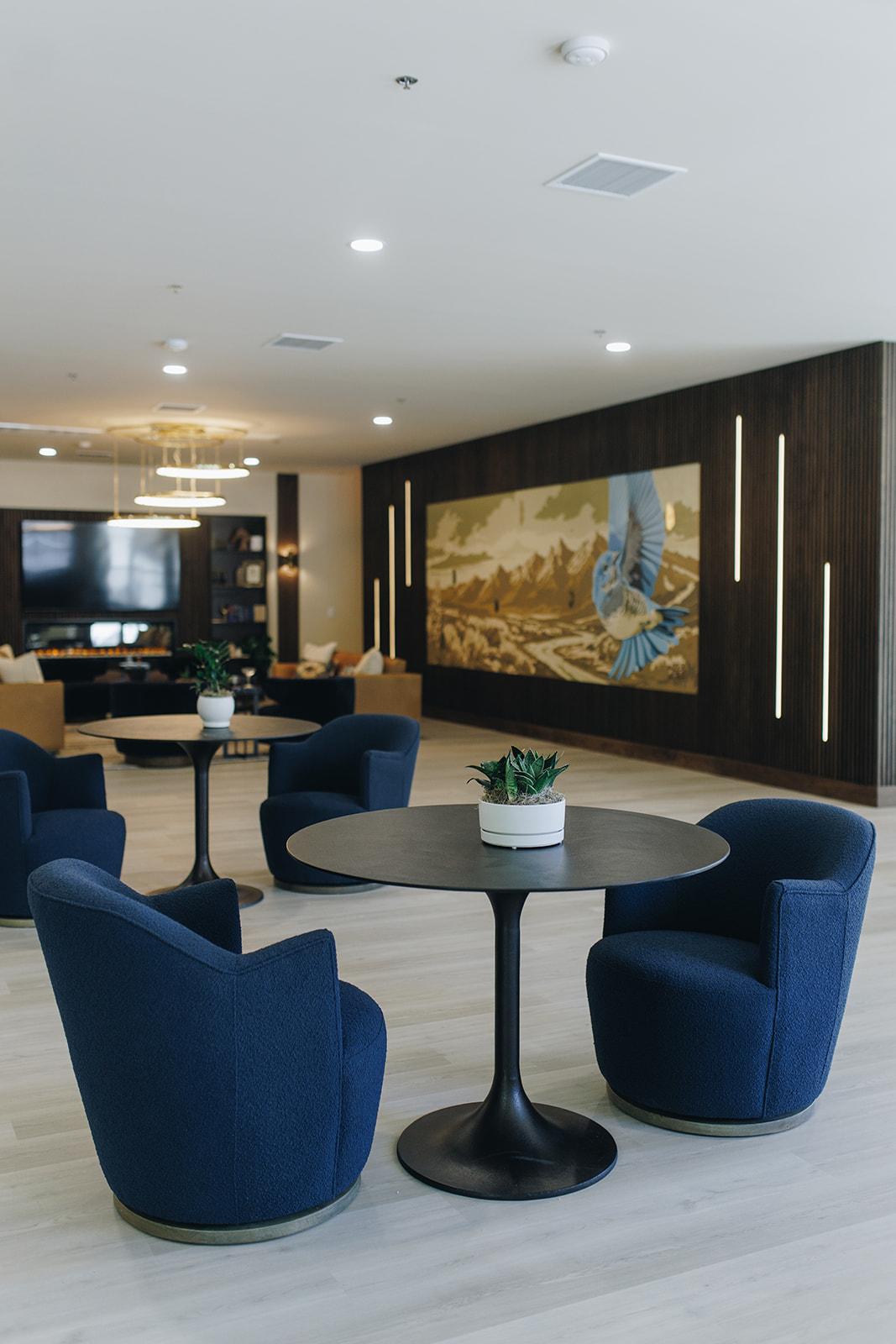 Leasing office lounge with dark accents and modern furniture