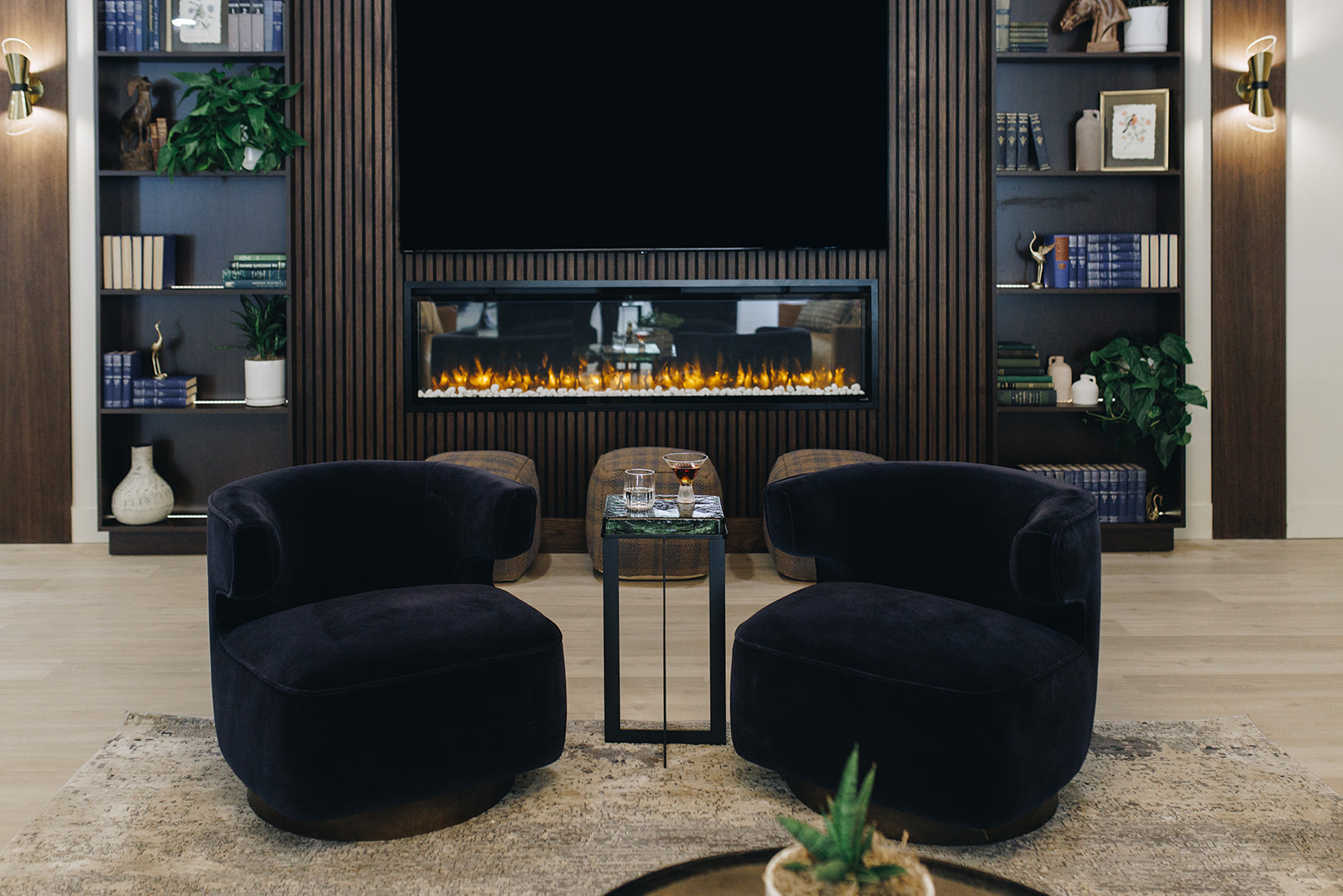 Leasing office lounge with dark accents and modern furniture