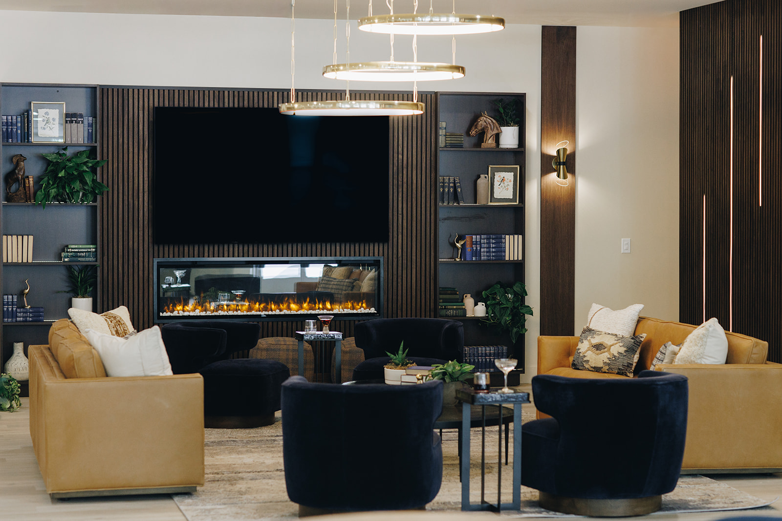 Leasing office lounge with dark accents and modern furniture