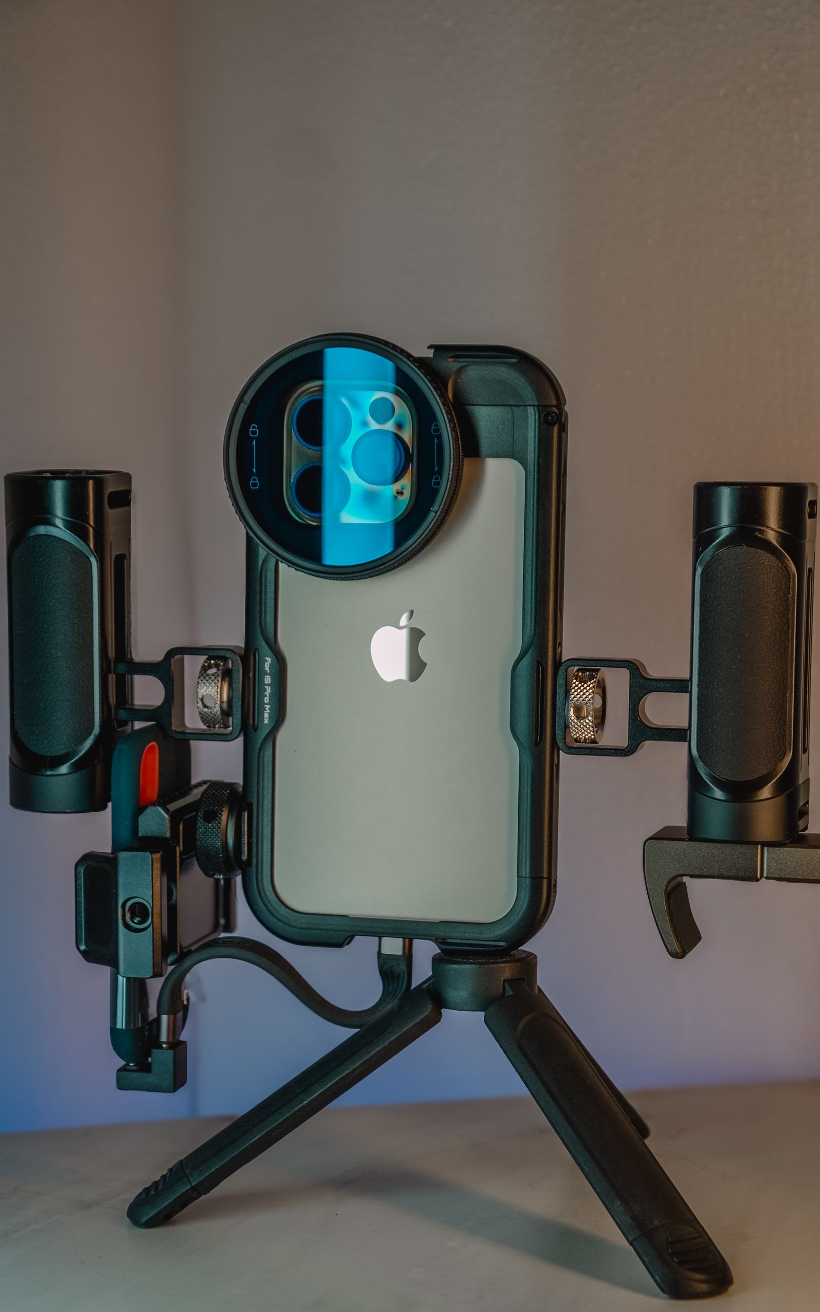 Smartphone mounted on a professional filming rig with studio lighting