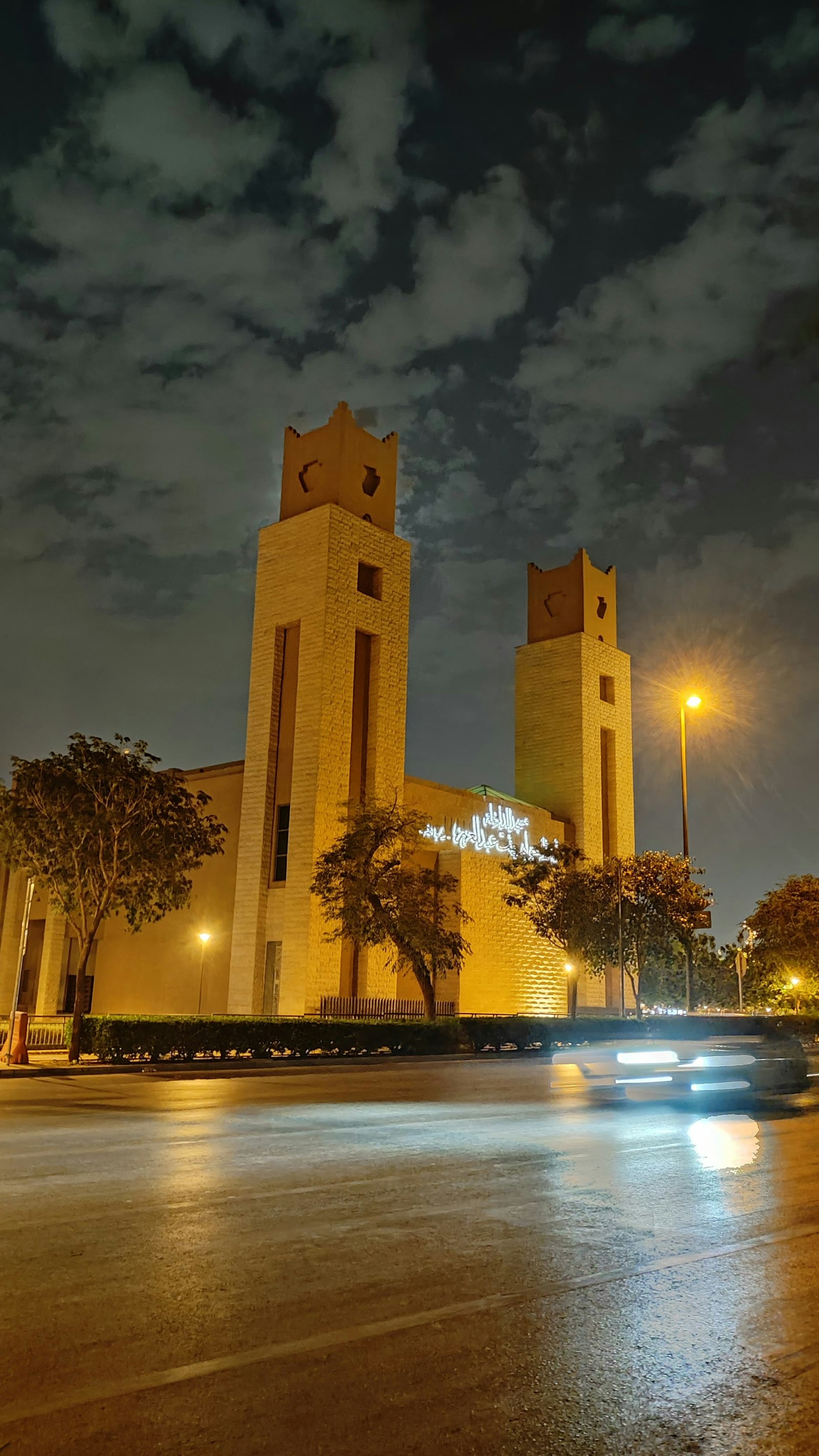 Riyadh street at night near an illuminated mosque