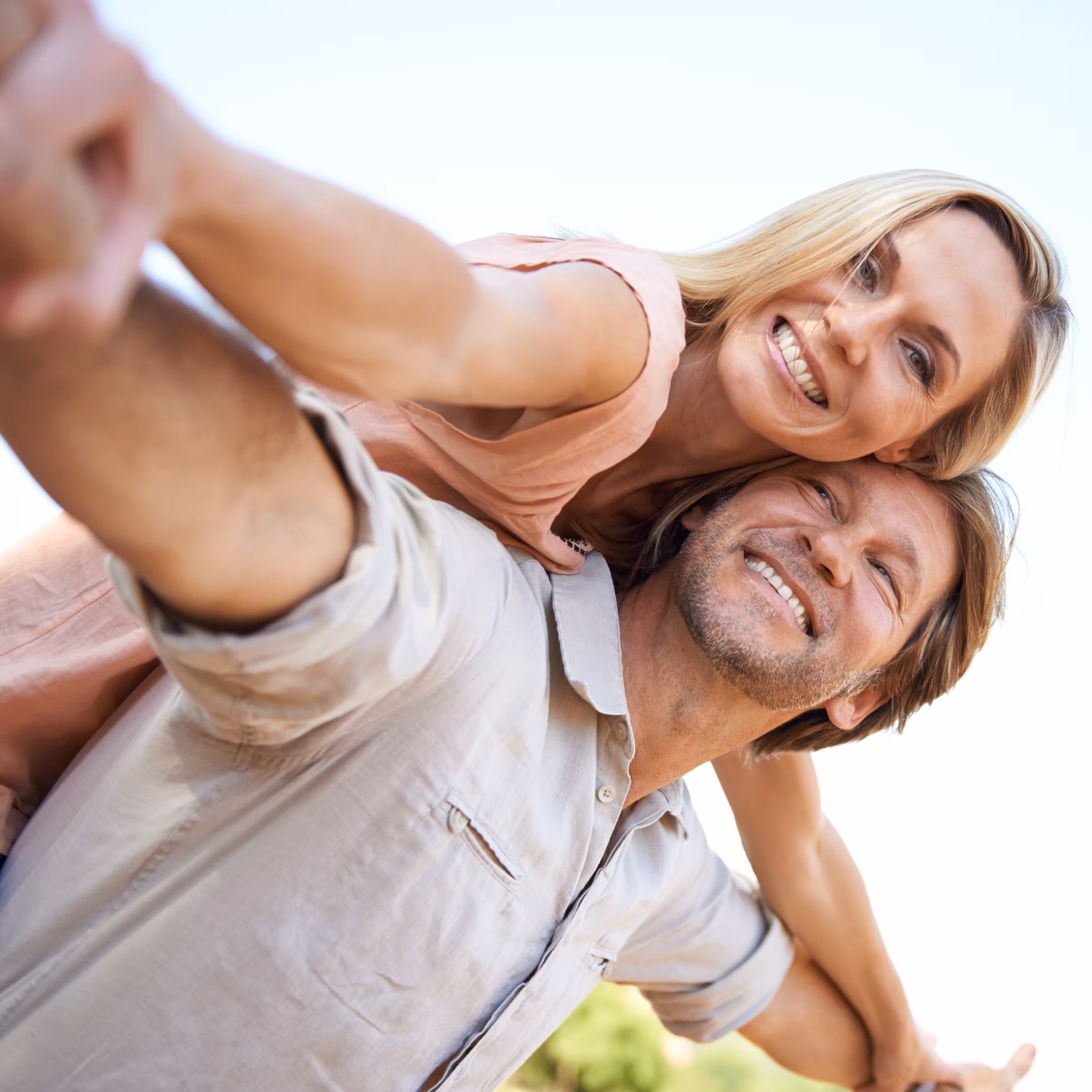 Smiling couple embracing outdoors