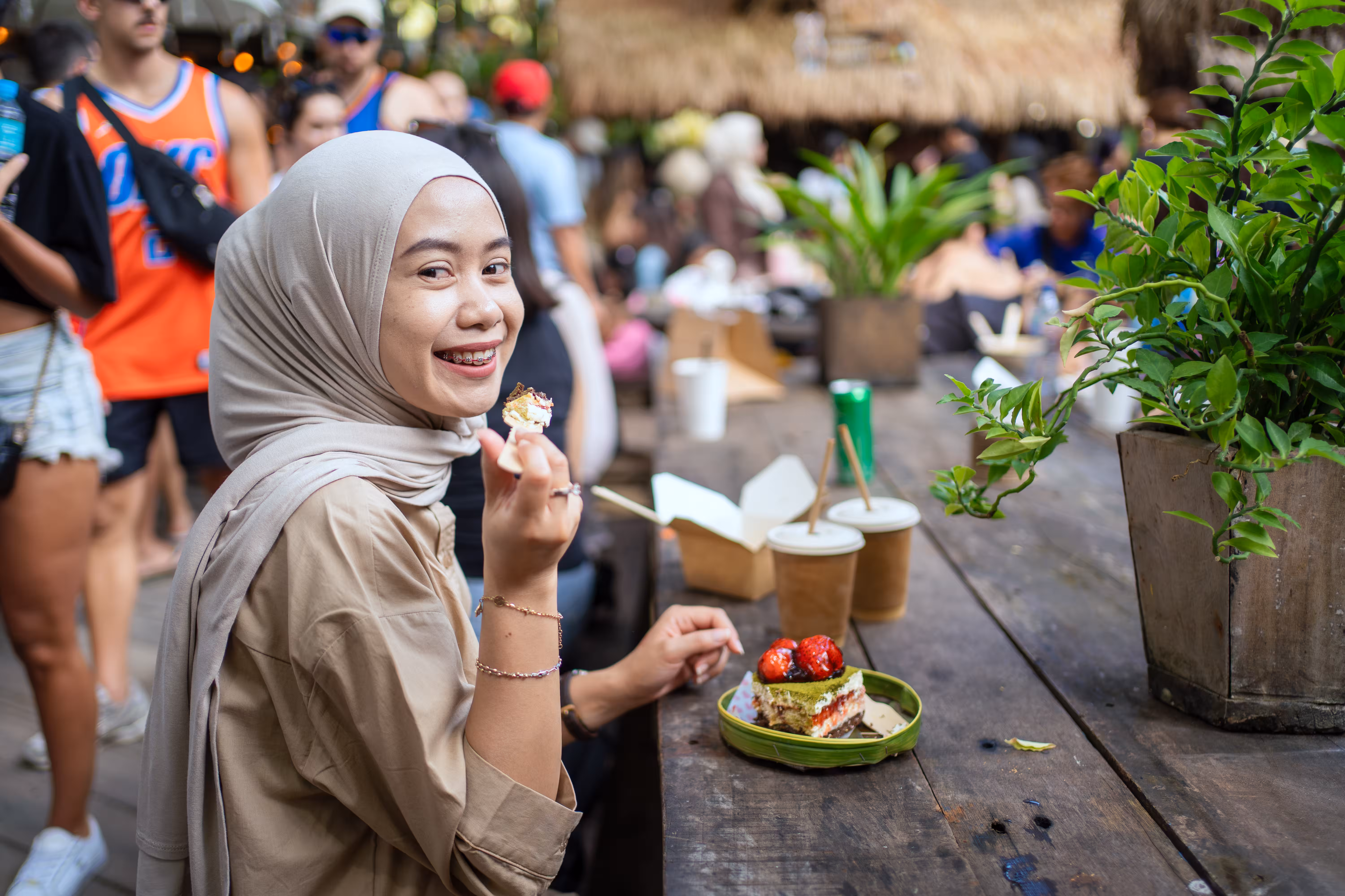 Woman eating at an outdoor market, protection visa requirements for Indonesian citizens
