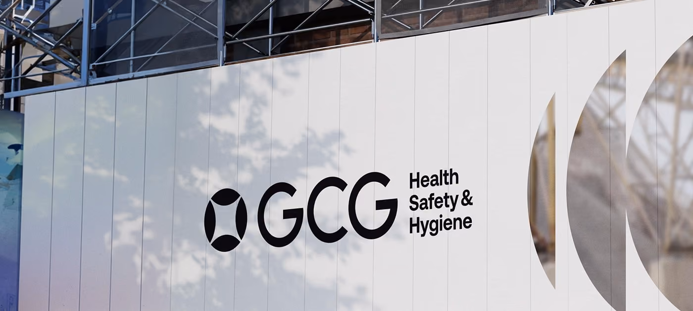 Branded signage in a healthcare client's reception area, with a family arriving.