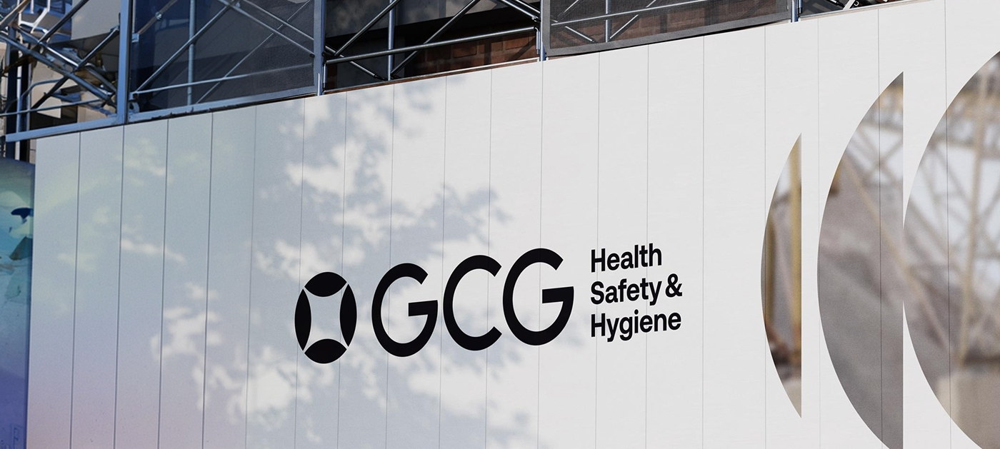 Branded signage in a healthcare client's reception area, with a family arriving.