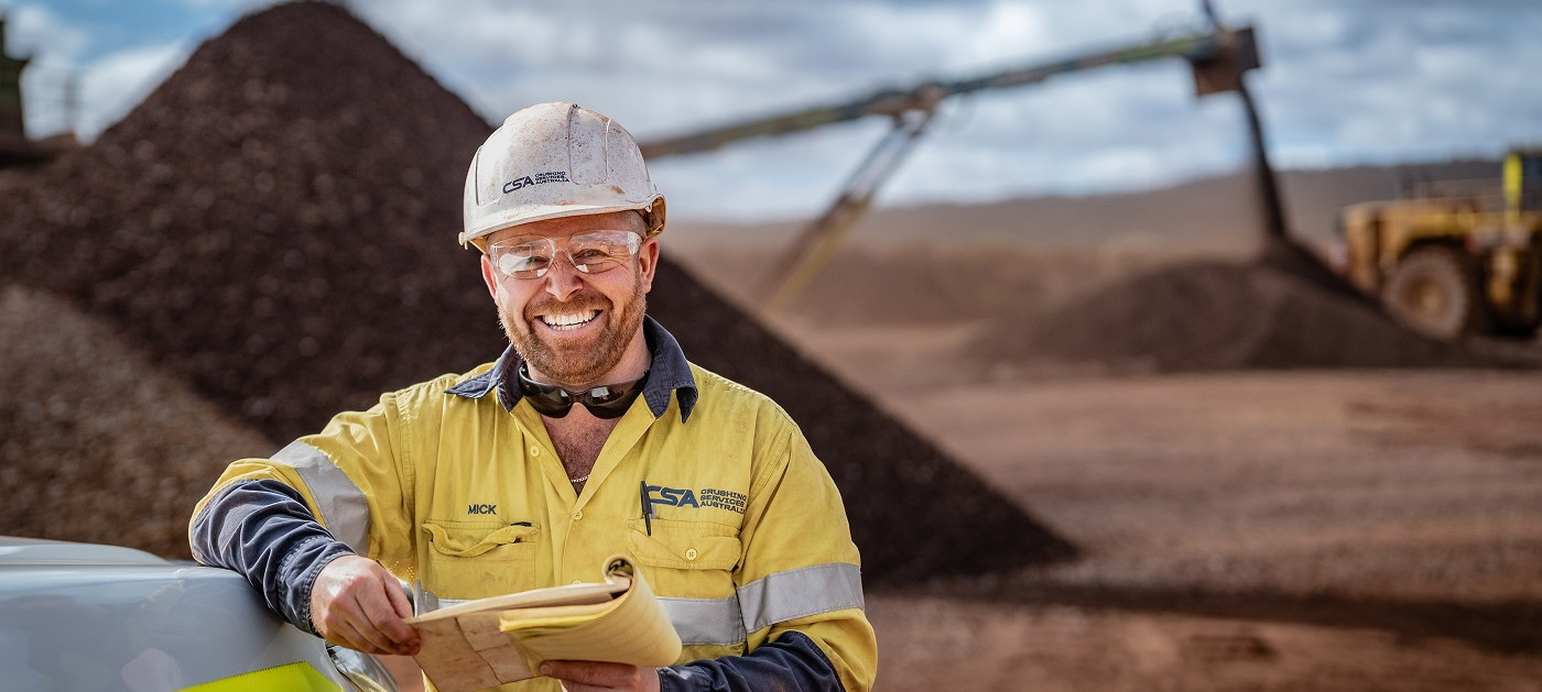 Mining equipment on site carrying brand identity designed by Four Stripes.