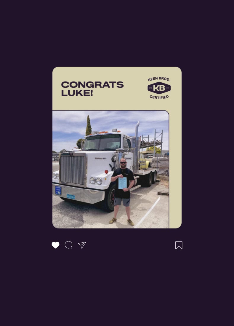 Man holding certificate standing in front of a large white truck with text Congrats Luke.