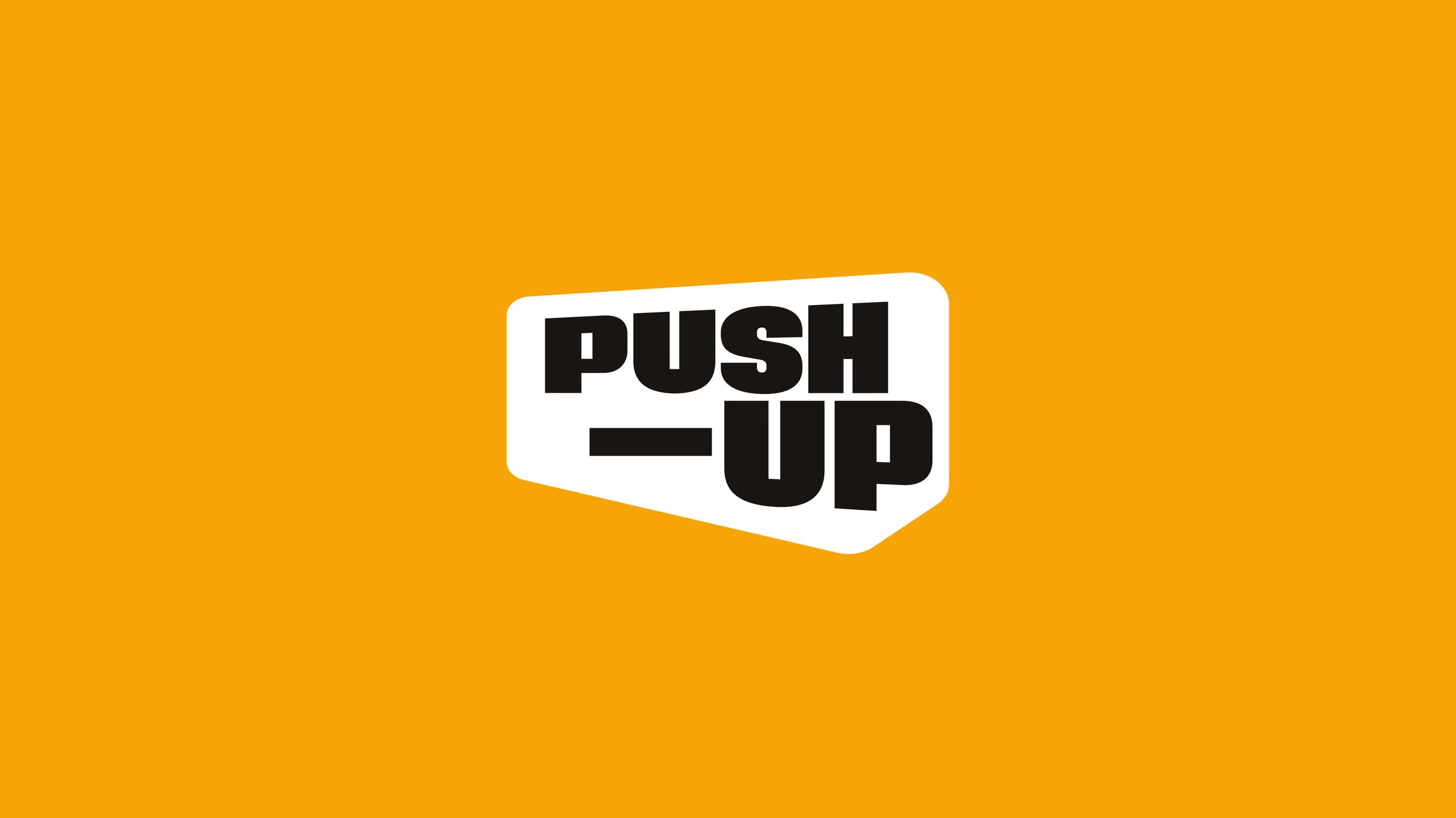 The Push-Up Challenge logo, a tilted white badge with black type, on an orange background.