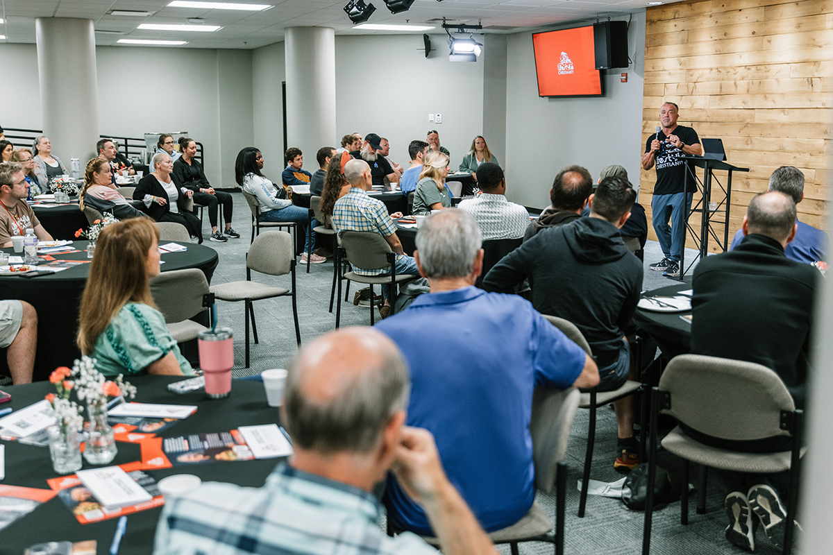 Guests sharing breakfast and conversation at Vision Breakfast