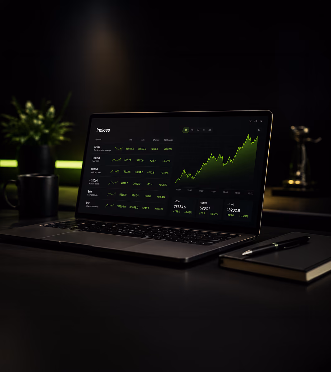 Laptop on dark desk with financial indices and green upward trend graph on screen.