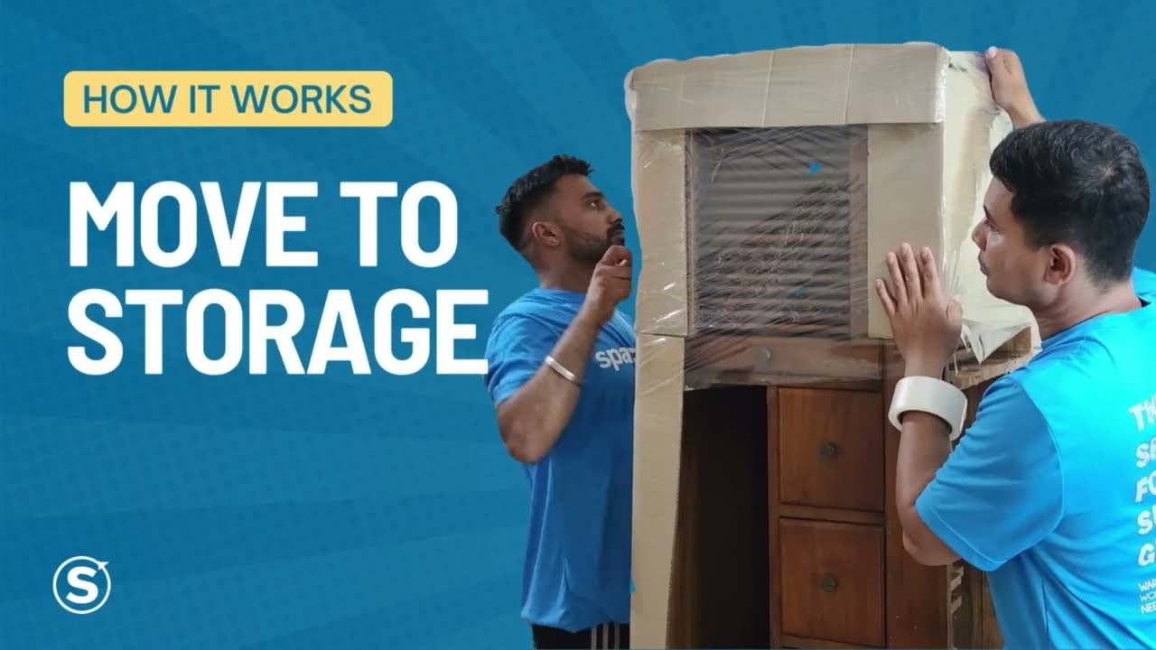 Spaceship movers wrapping and preparing belongings before storage in Singapore