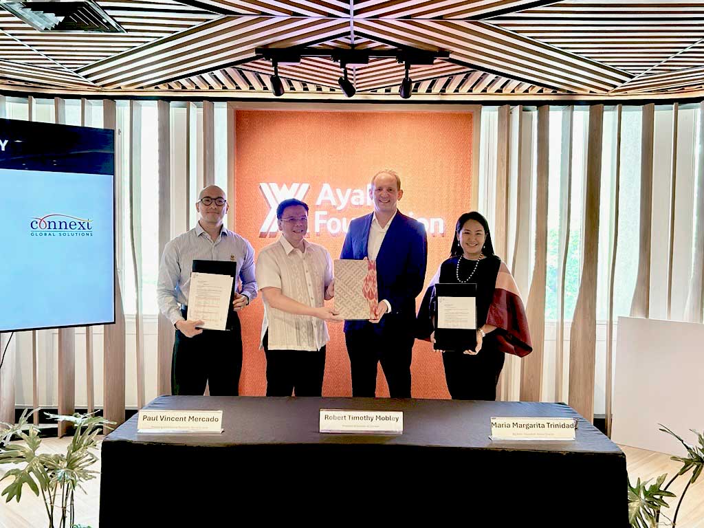 Connext and Ayala Foundation exchange signed partnership documents, April 17, 2026)