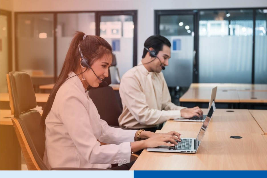 Operator asian woman agent with headset working with laptop on customer consultation in the office