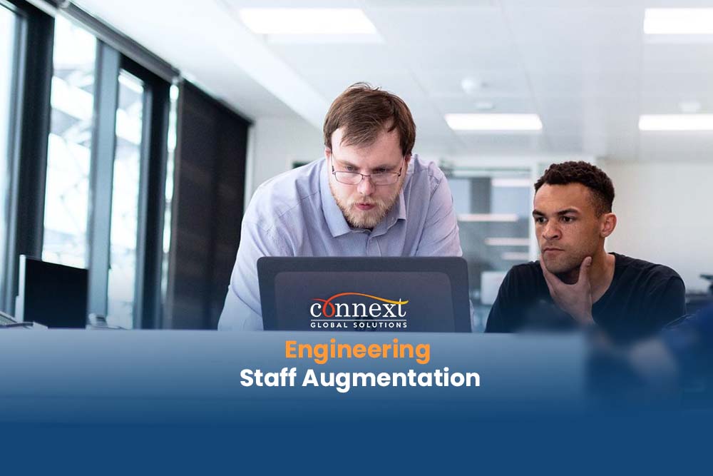 Engineering Staff Augmentation caucasian latino working inside office with laptop