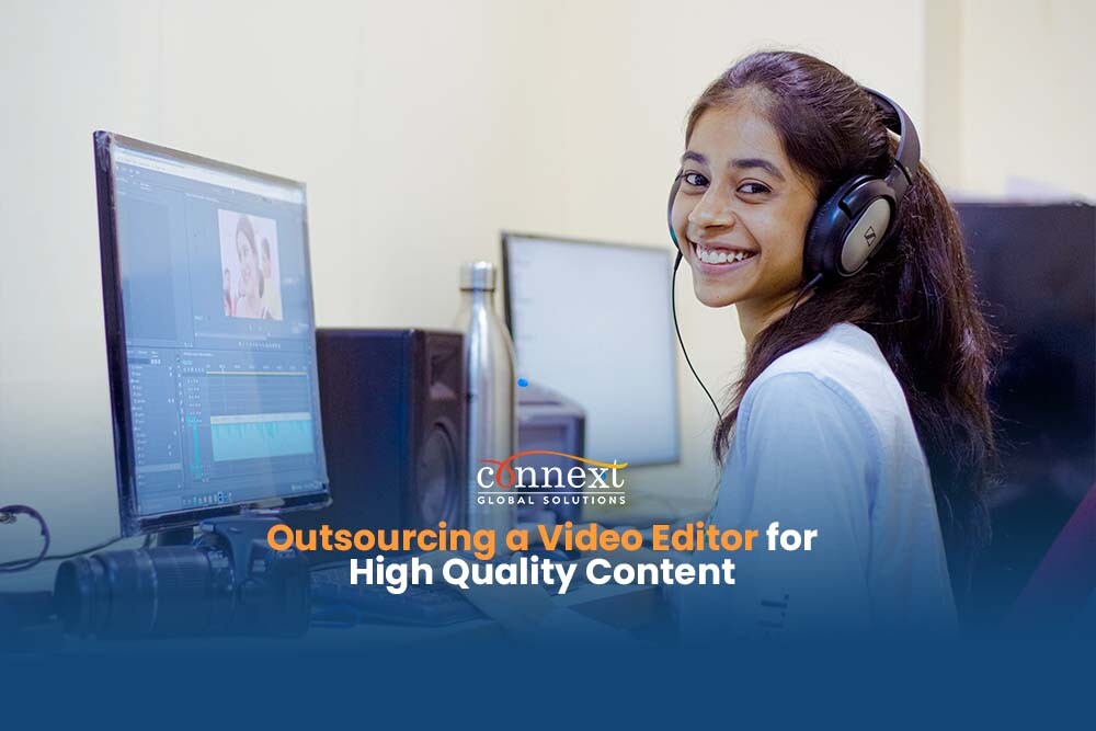 Outsourcing-a-Video-Editor-for-High-Quality-Content-girl-with-headphones-smiling-while-working-using-a-computer-in-office