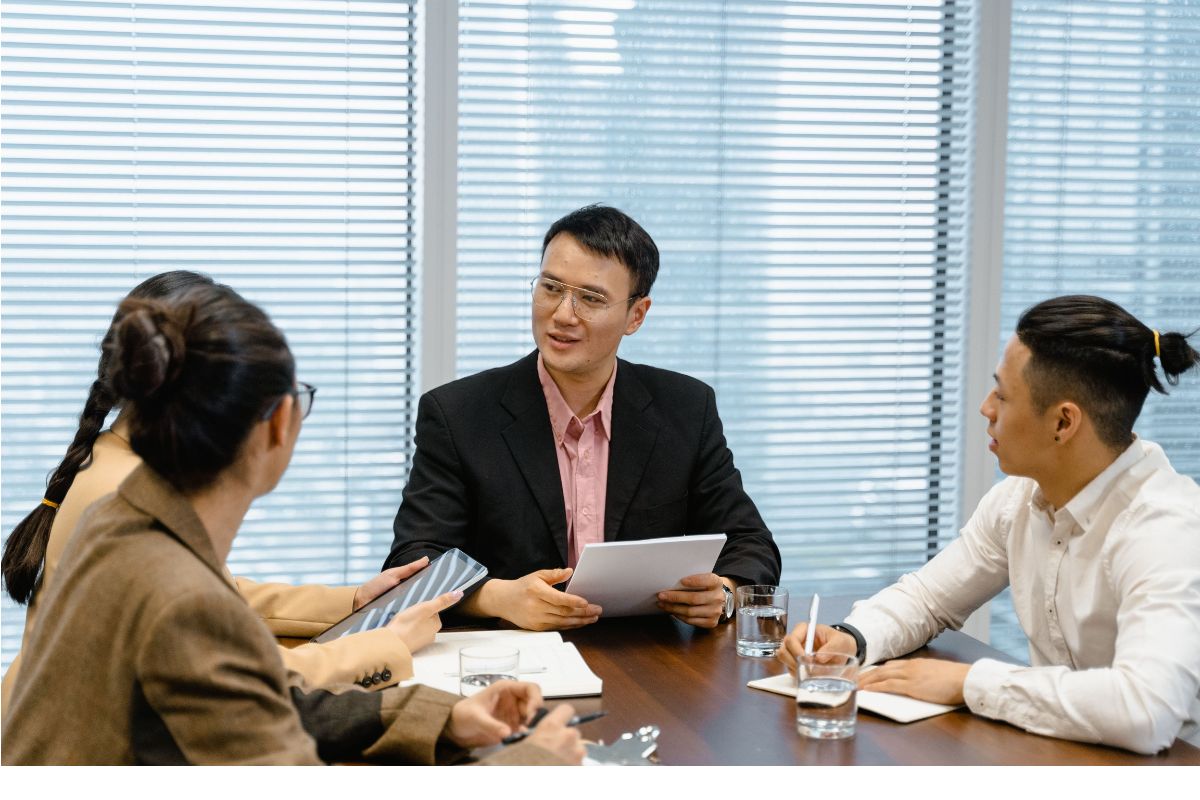 Clients talking about how to compare outsourcing pricing models