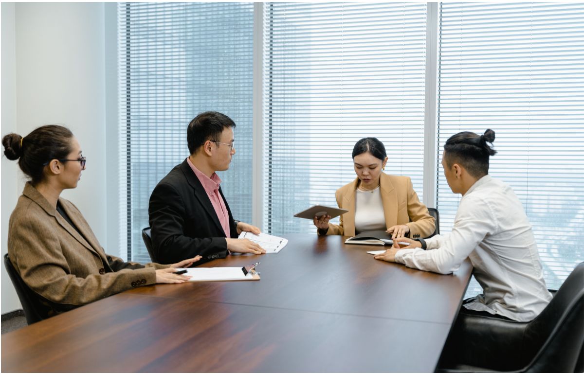 Workers discussing about offshore staffing provider