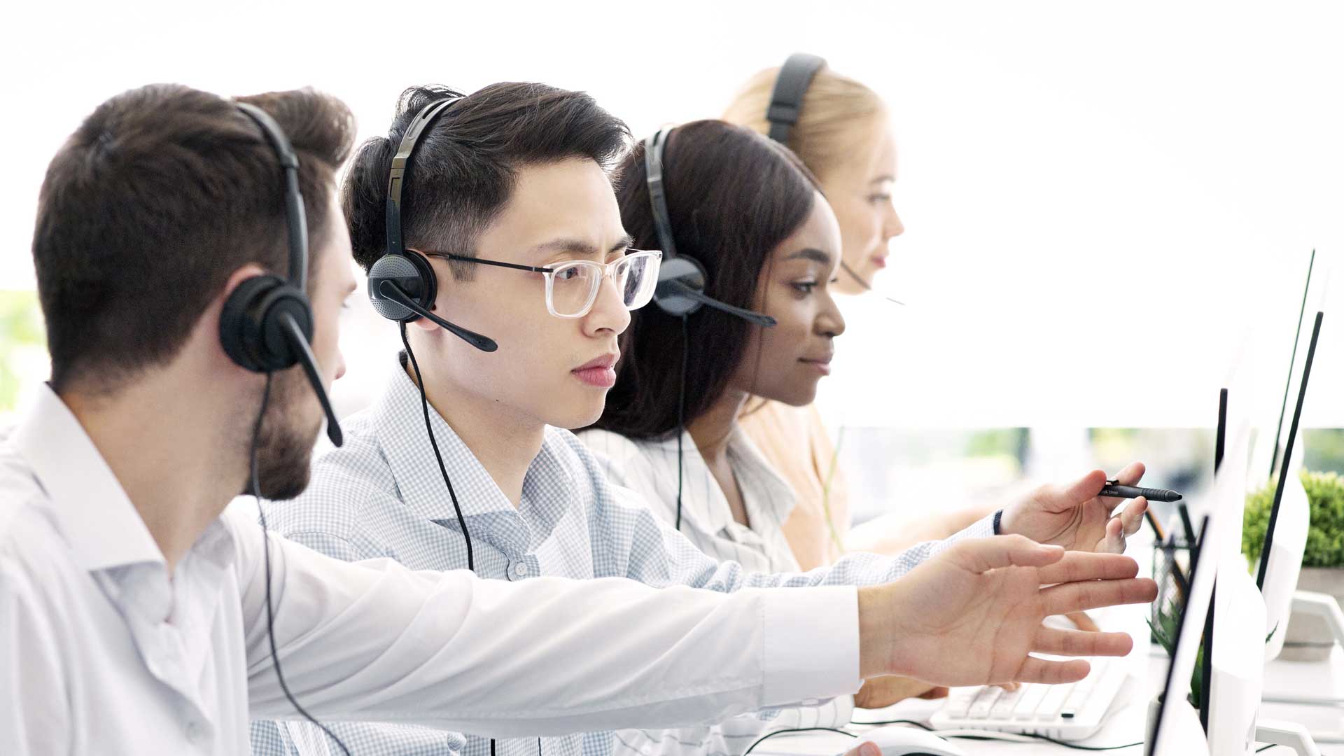 Support team working in a call center.|