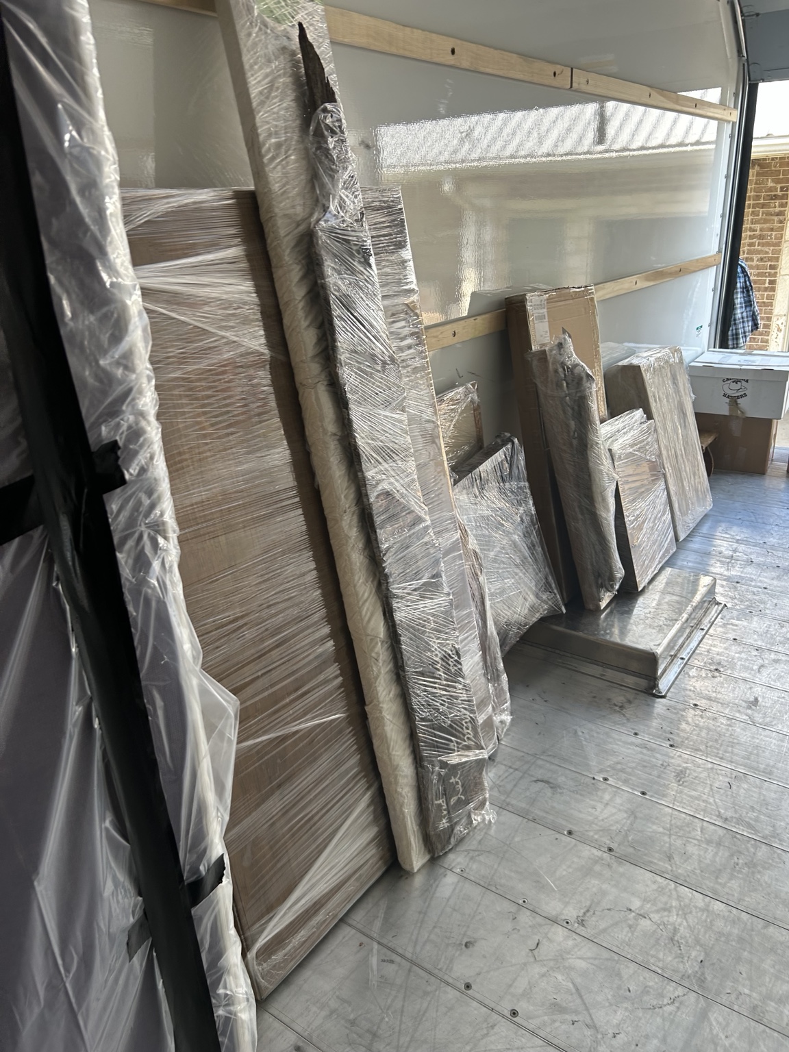 Wrapped furniture inside a moving truck