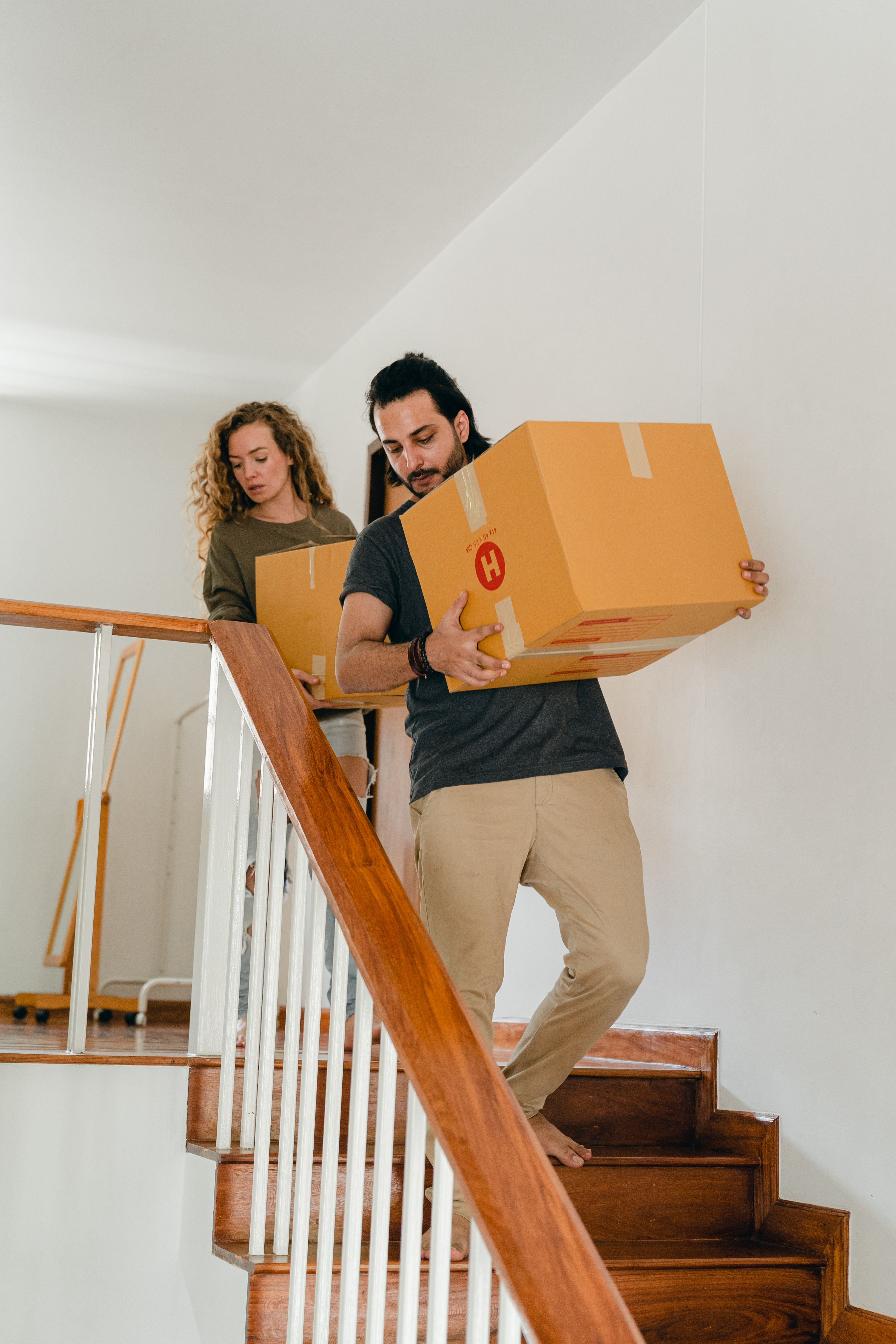Movers carrying boxes during a move