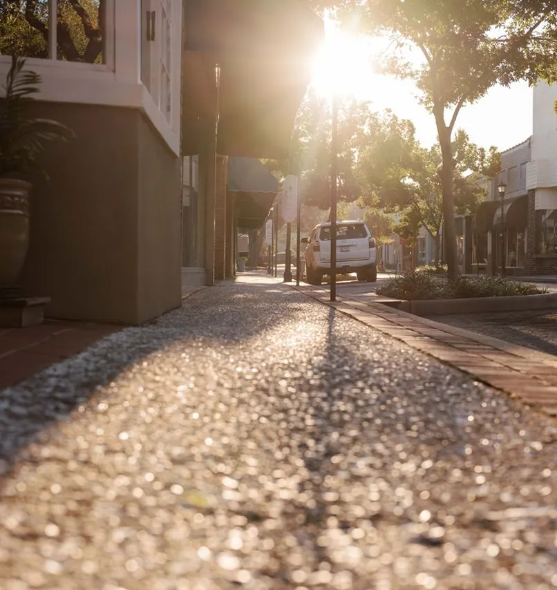 Sunlit sidewalk and storefronts in downtown Walterboro