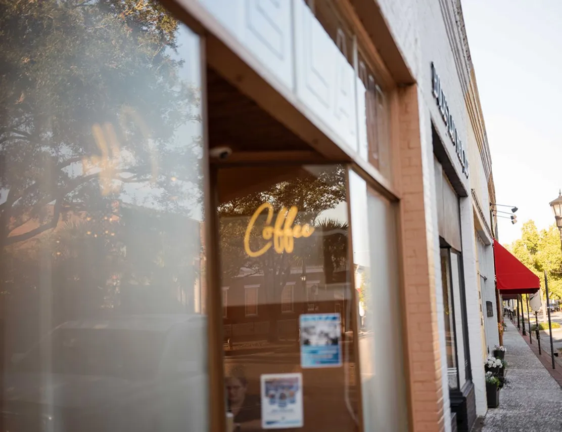 Coffee shop window along a downtown Walterboro sidewalk