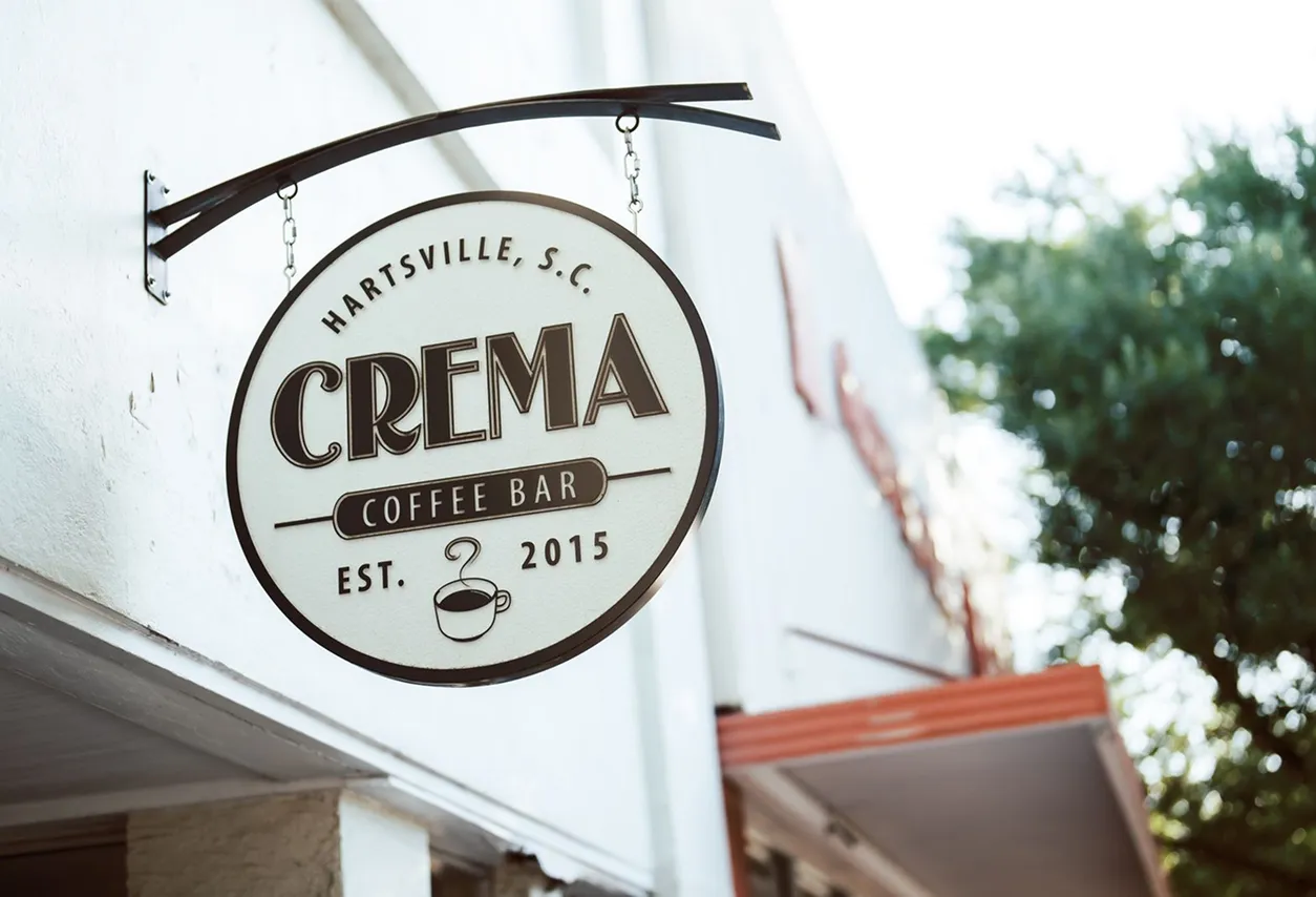 Crema Coffee Bar hanging sign in Hartsville, South Carolina