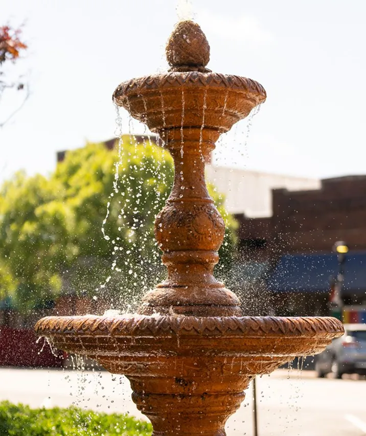 Decorative outdoor fountain spraying water in downtown Cheraw