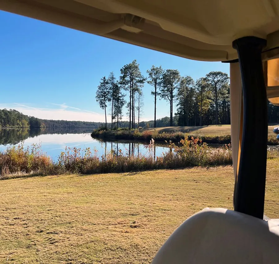 Scenic lake and golf course viewed from a golf cart