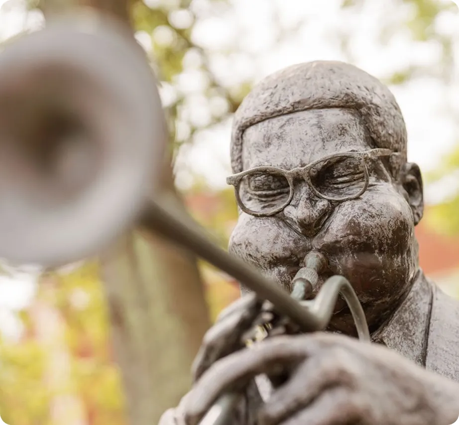 Bronze statue of a musician playing the trombone